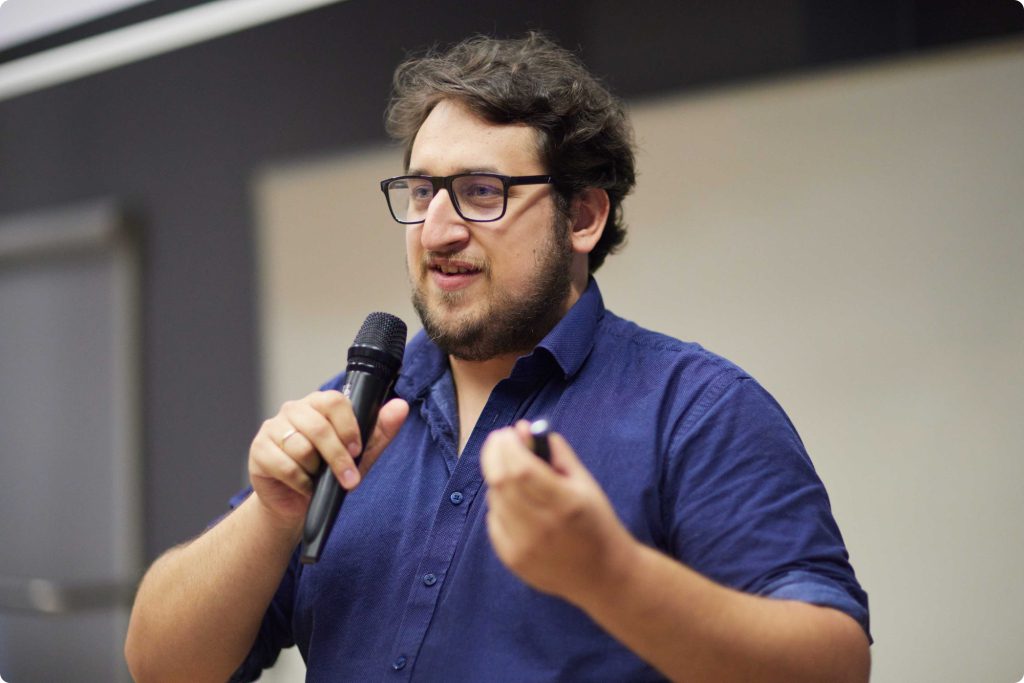 Michał Strześniewski speaking to the audience at the event